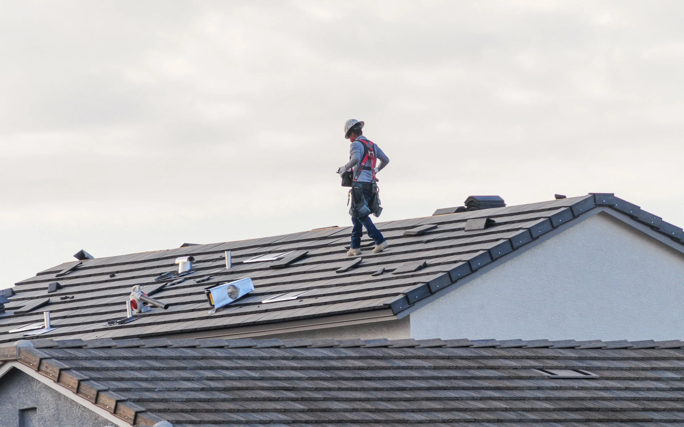 Roofer performing a roof inspection in Sun City, AZ, roofing contractor in Sun City, AZ